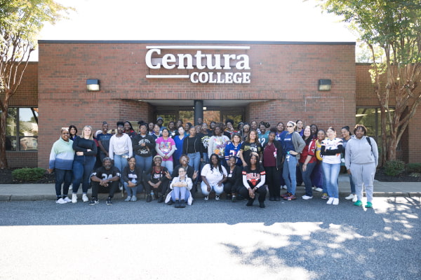 Students standing in front of campus building