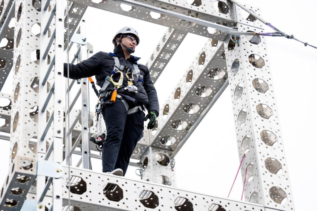 Centura College Wind Turbine Technician Student Looking Out from Tower