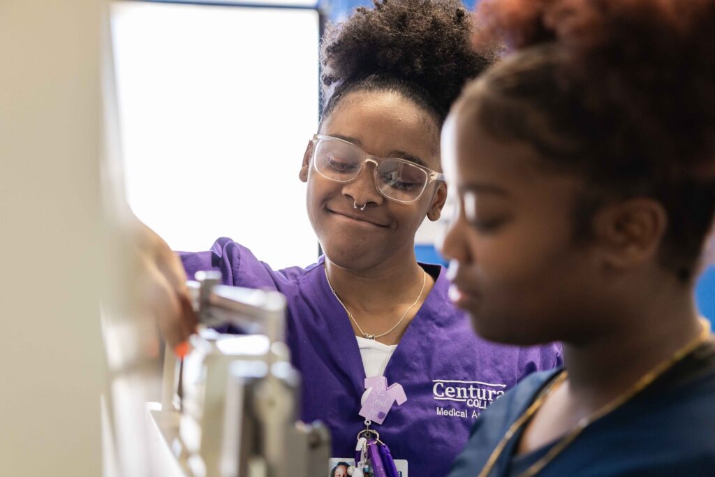 Centura College medical assistant student in hands-on training