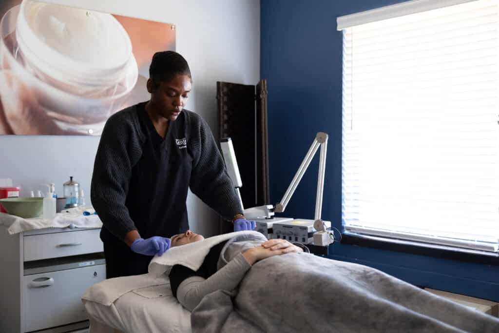 Centura College esthetician student working in cosmetology lab
