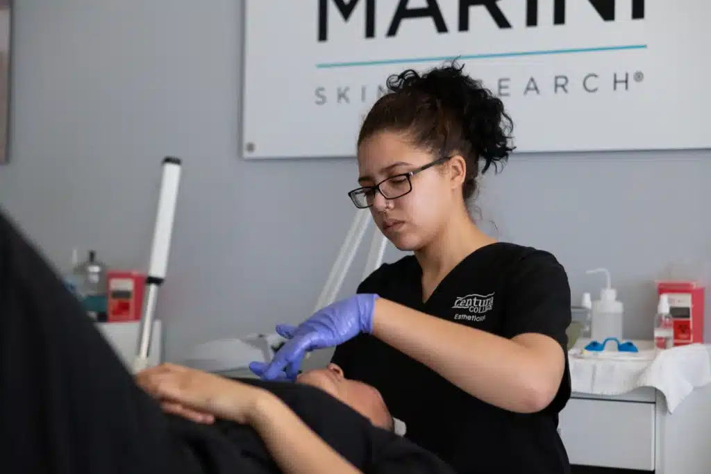 Centura College esthetician student in professional skin care lab