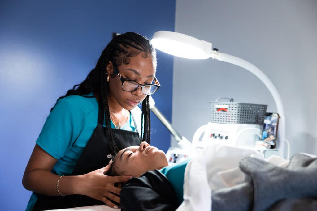 Centura College esthetician student in skin care training