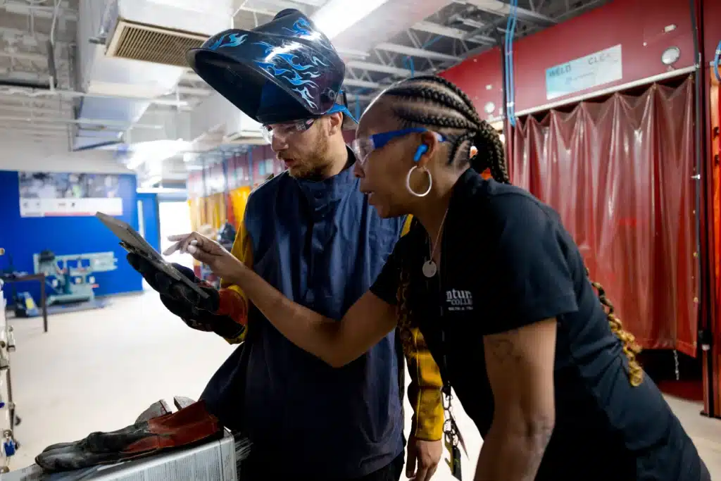 Centura College welding student wearing protective gear at welding station